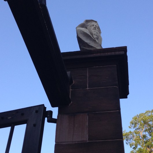 Hades atop the front gate pillar